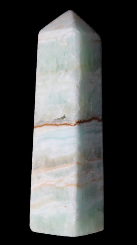 Pistachio Calcite obelisk 122mm 290g in sunlight - Rocks and Things Store