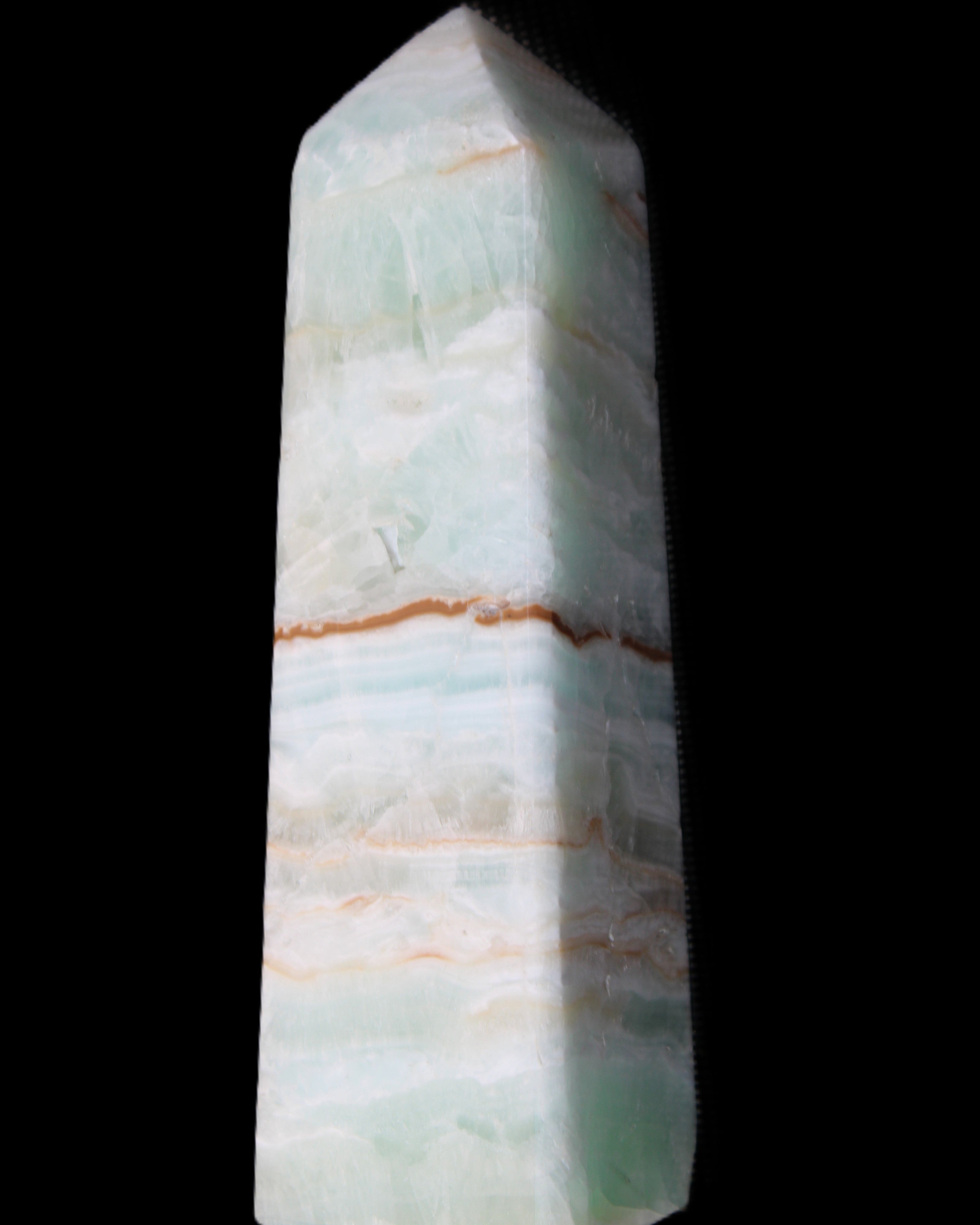 Pistachio Calcite obelisk 122mm 290g in sunlight - Rocks and Things Store