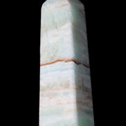 Pistachio Calcite obelisk 122mm 290g in sunlight - Rocks and Things Store