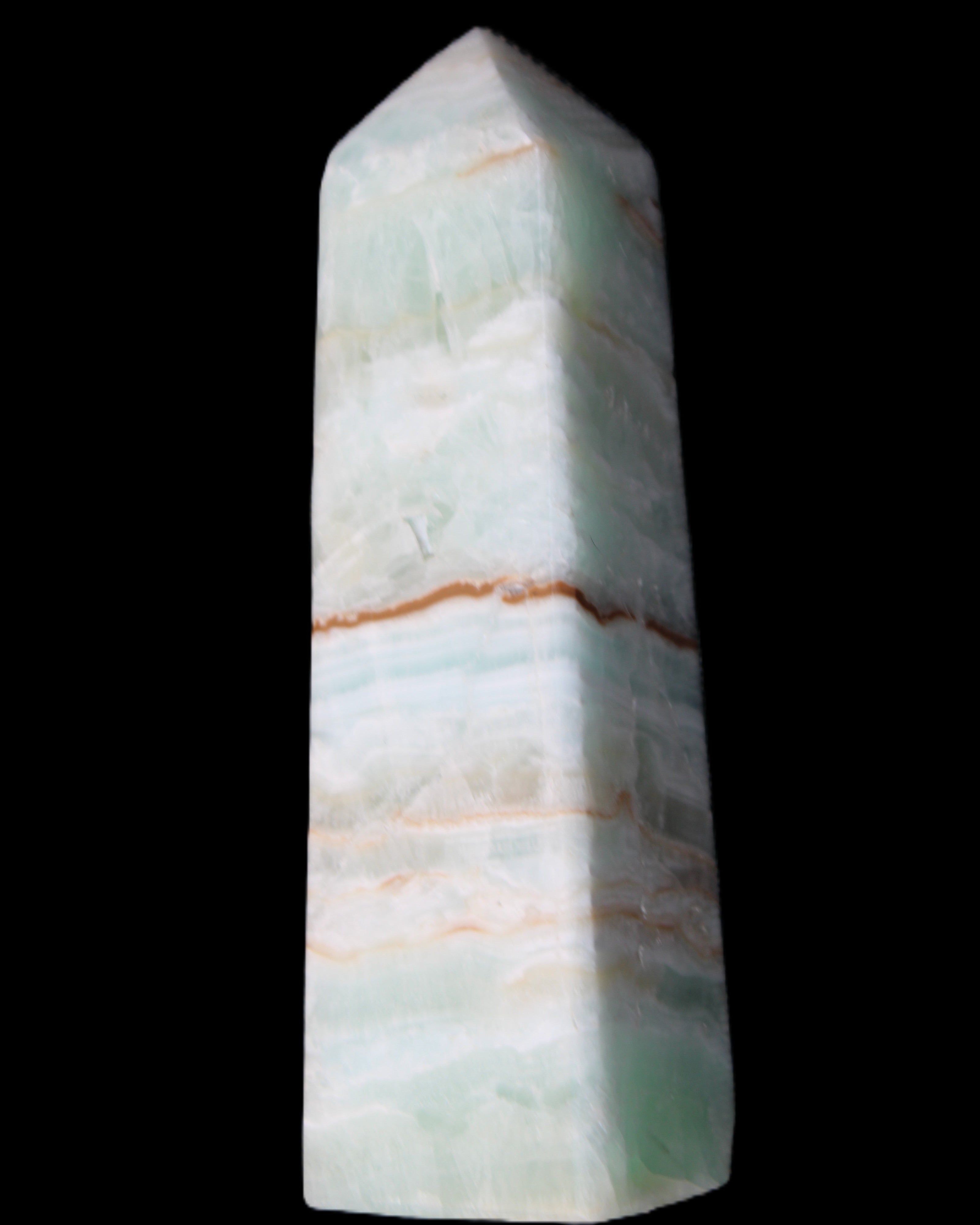 Pistachio Calcite obelisk 122mm 290g in sunlight - Rocks and Things Store