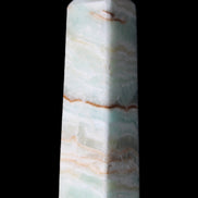 Pistachio Calcite obelisk 122mm 290g in sunlight - Rocks and Things Store