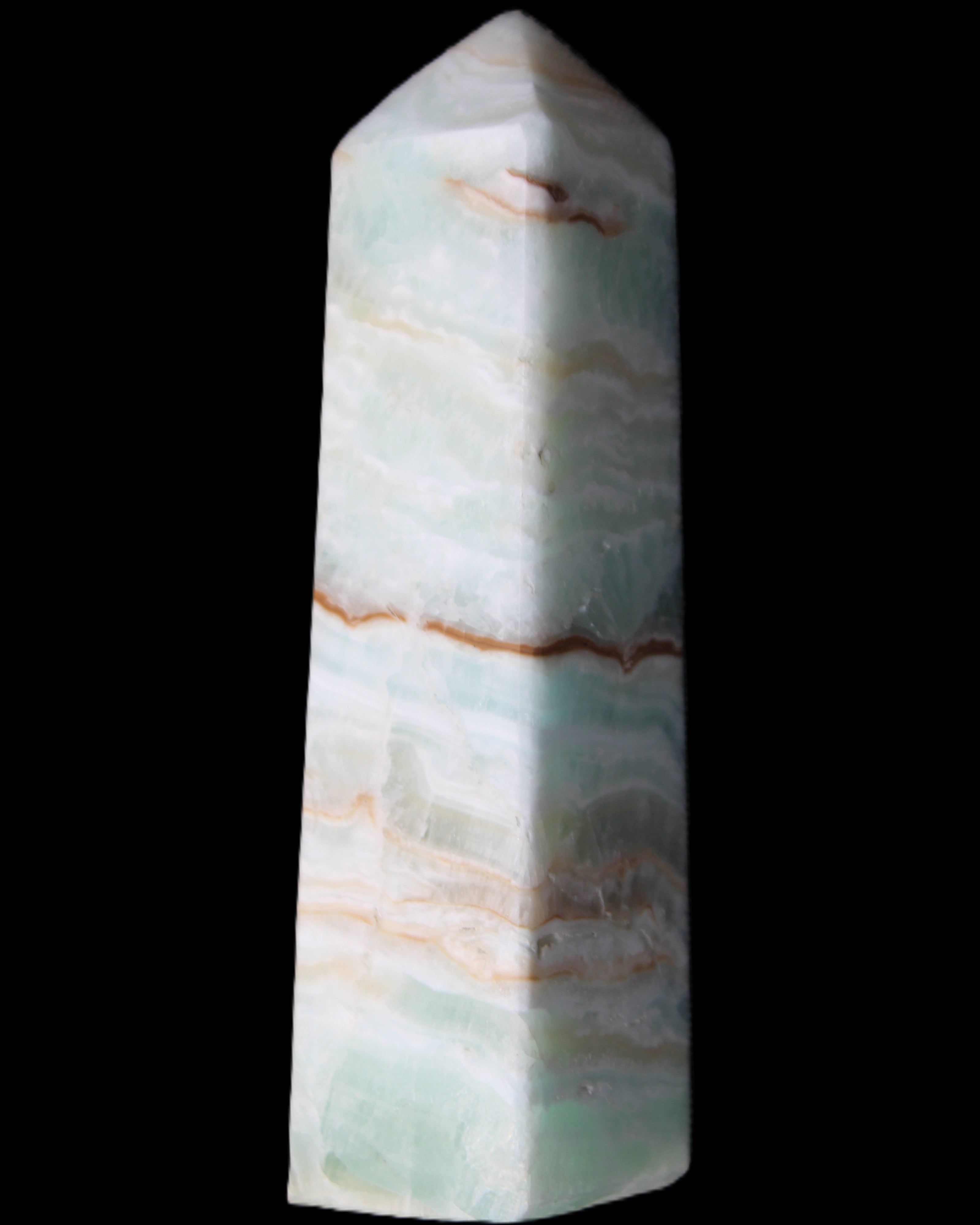 Pistachio Calcite obelisk 122mm 290g in sunlight - Rocks and Things Store