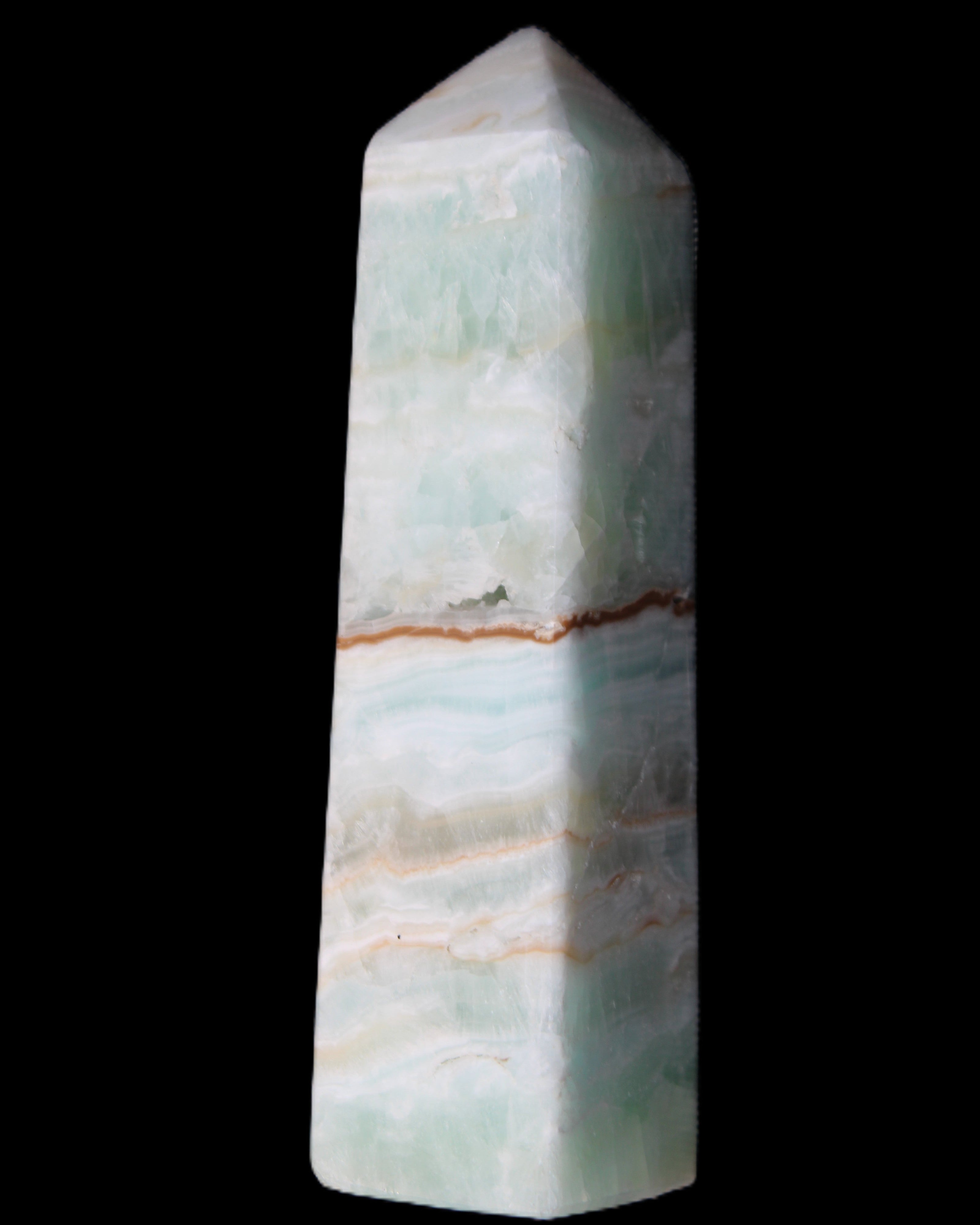 Pistachio Calcite obelisk 122mm 290g in sunlight - Rocks and Things Store