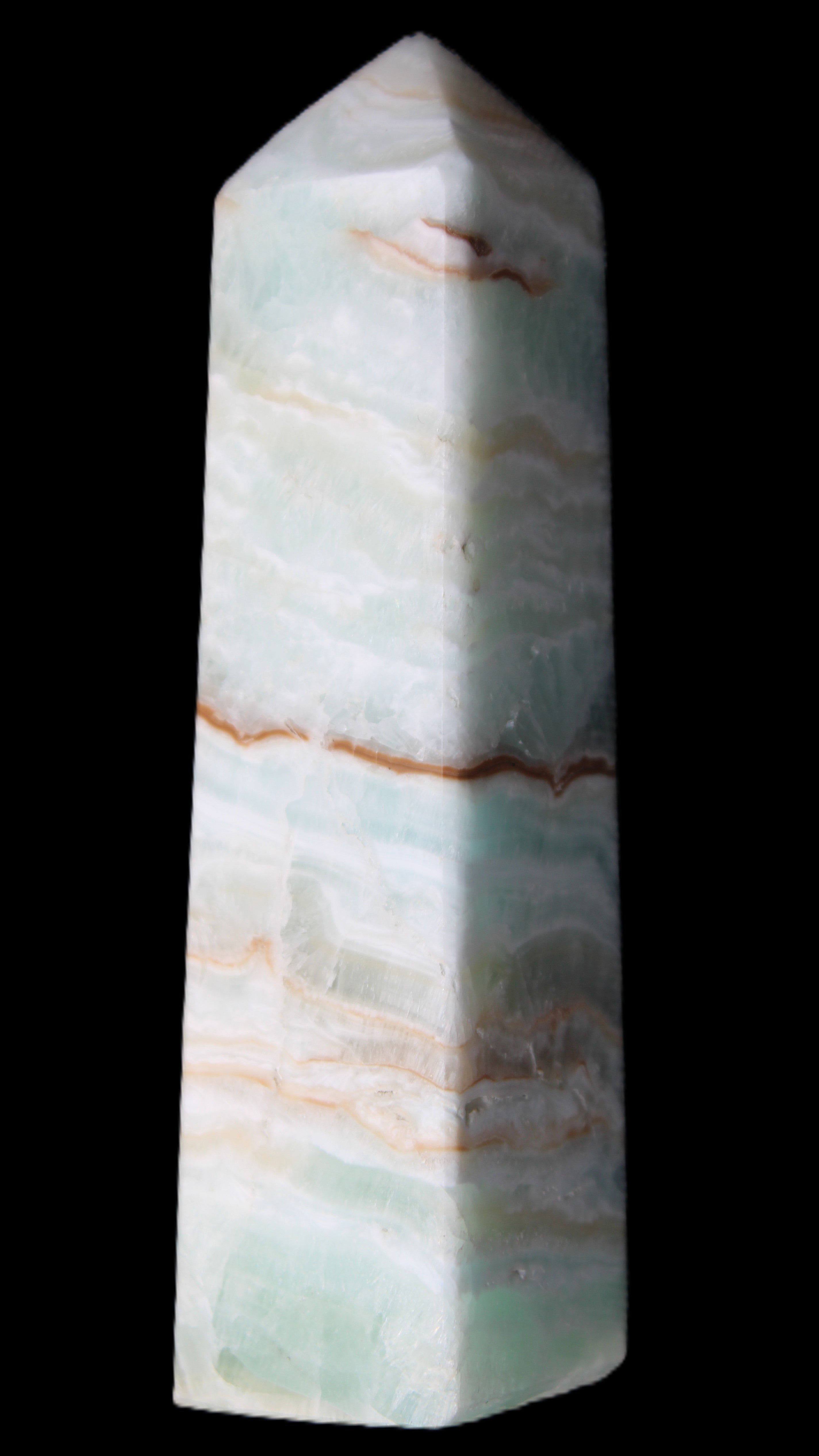 Pistachio Calcite obelisk 122mm 290g in sunlight - Rocks and Things Store