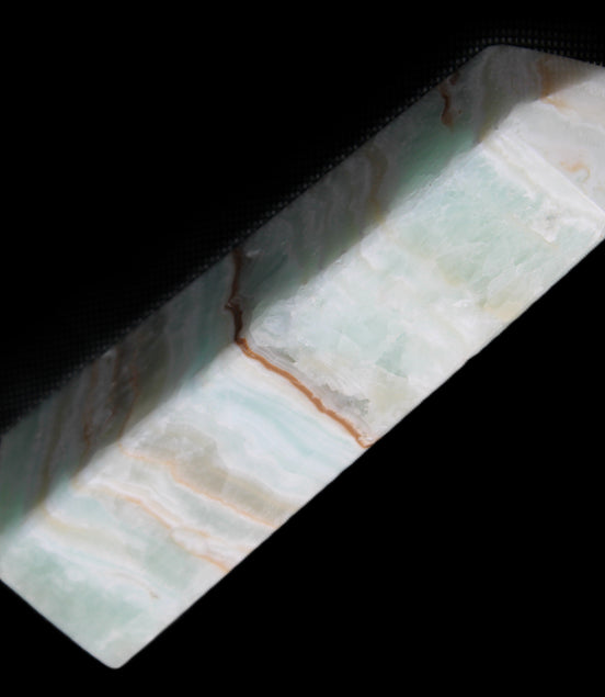 Pistachio Calcite obelisk 122mm 290g in sunlight - Rocks and Things Store