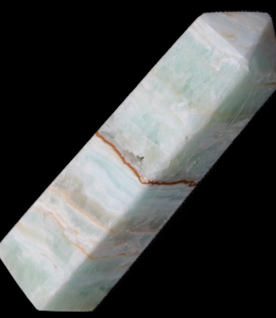 Pistachio Calcite obelisk 122mm 290g in sunlight - Rocks and Things Store