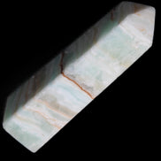 Pistachio Calcite obelisk 122mm 290g in sunlight - Rocks and Things Store