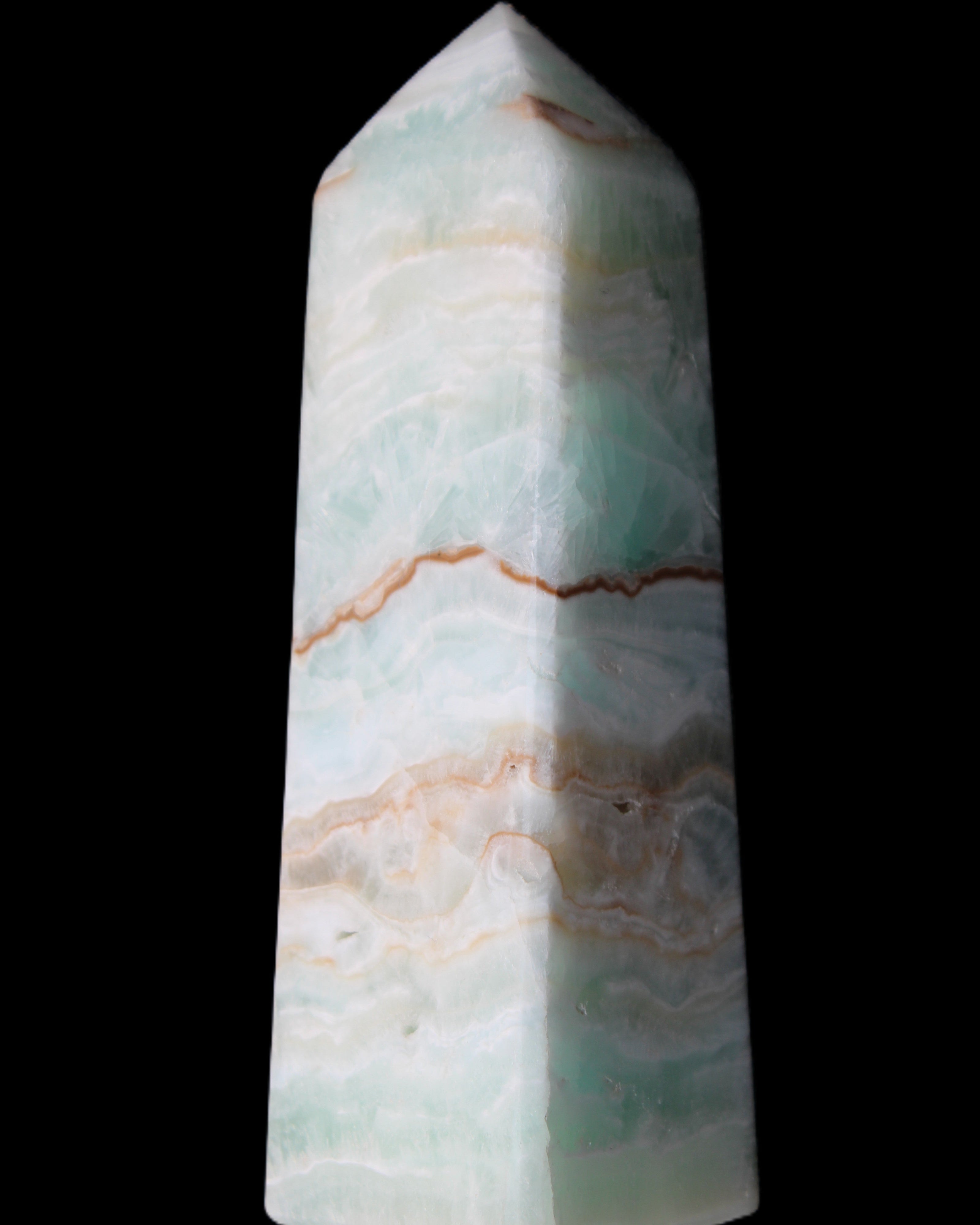 Pistachio Calcite obelisk 122mm 328g in sunlight - Rocks and Things Store