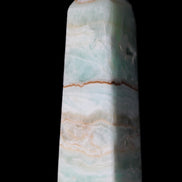 Pistachio Calcite obelisk 122mm 328g in sunlight - Rocks and Things Store