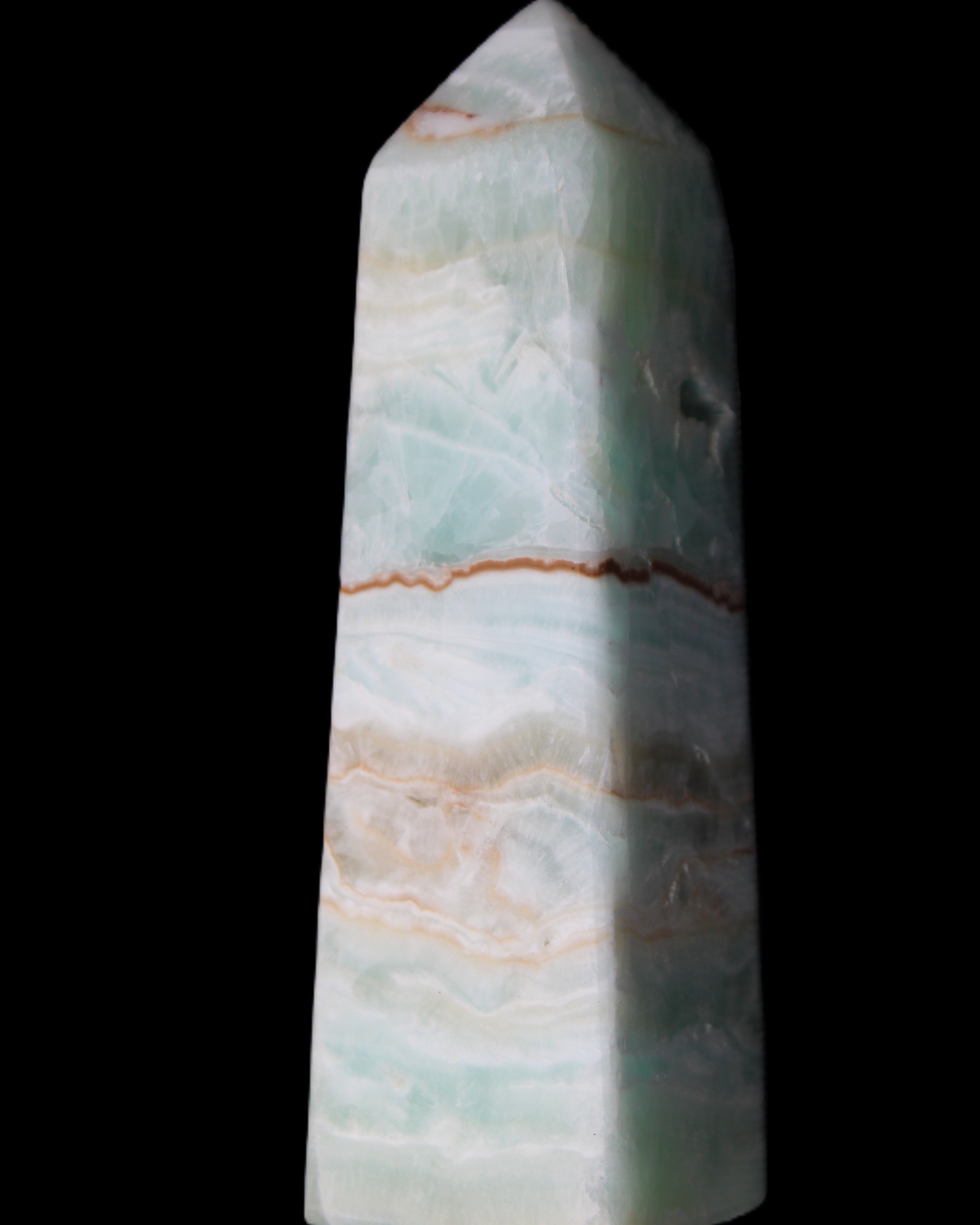 Pistachio Calcite obelisk 122mm 328g in sunlight - Rocks and Things Store