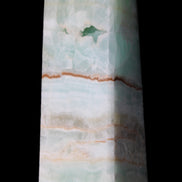 Pistachio Calcite obelisk 122mm 328g in sunlight - Rocks and Things Store