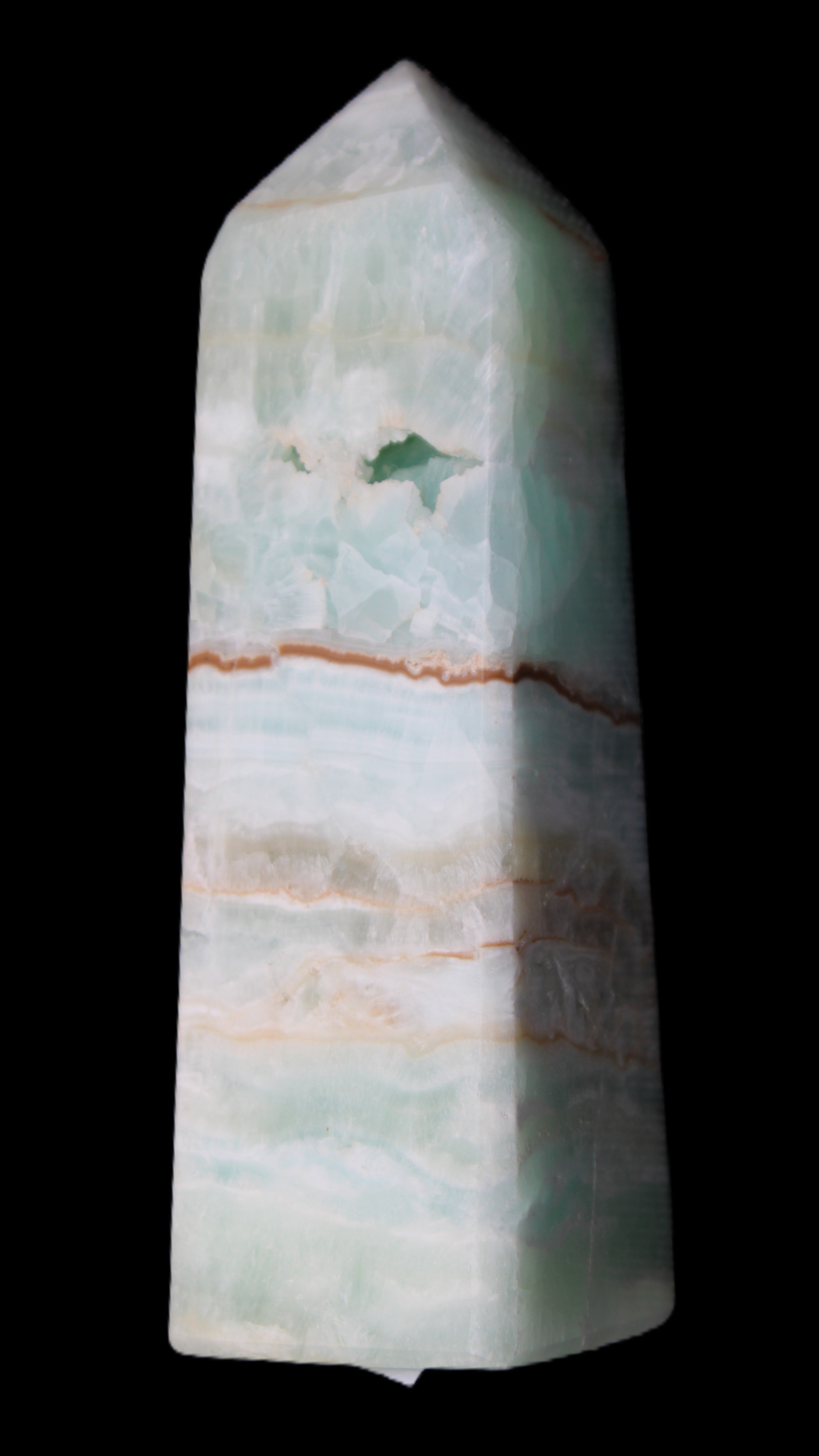 Pistachio Calcite obelisk 122mm 328g in sunlight - Rocks and Things Store
