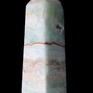 Pistachio Calcite obelisk 122mm 328g in sunlight - Rocks and Things Store