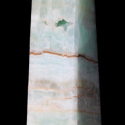Pistachio Calcite obelisk 122mm 328g in sunlight - Rocks and Things Store