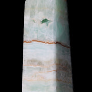 Pistachio Calcite obelisk 122mm 328g in sunlight - Rocks and Things Store