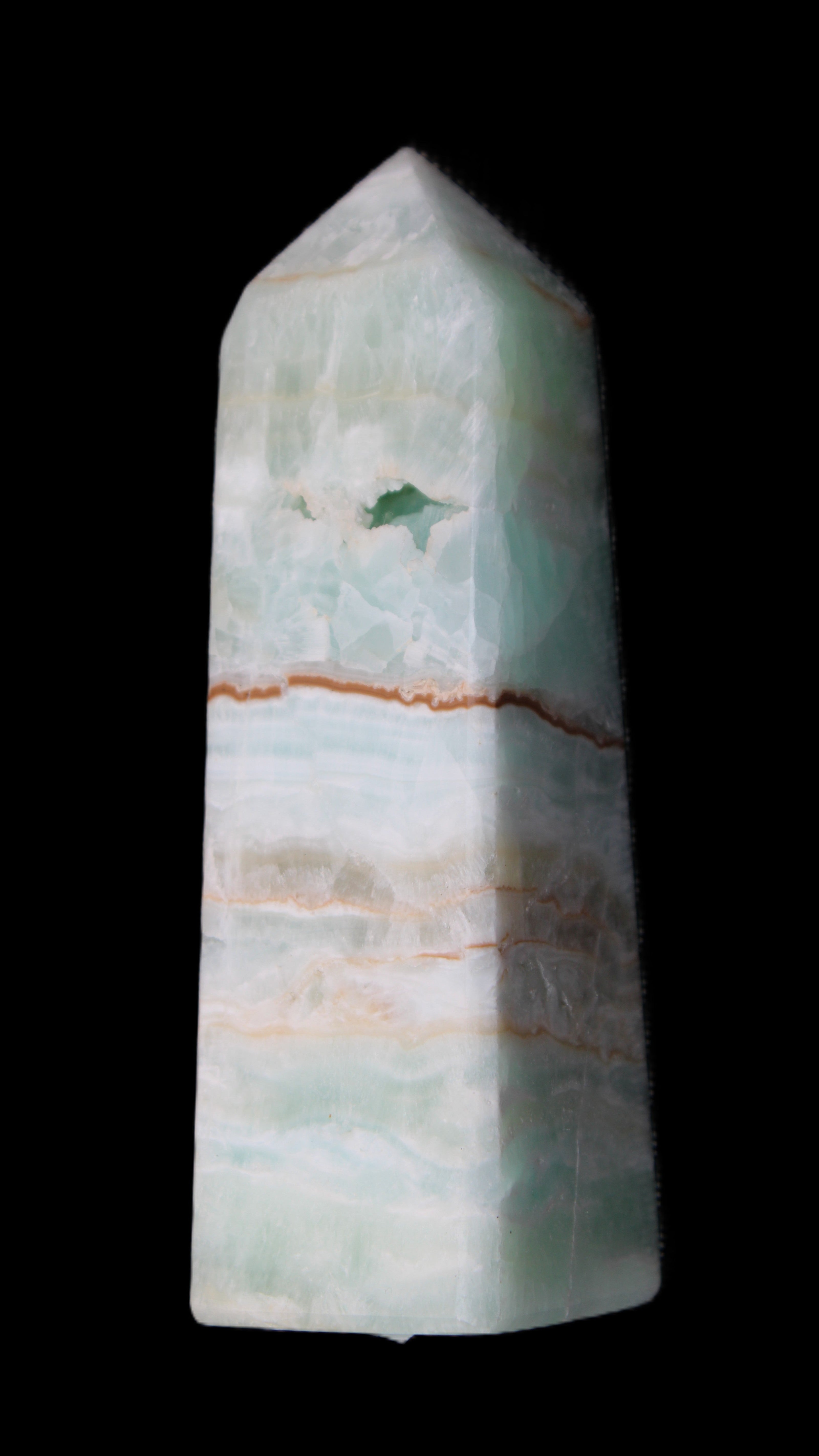 Pistachio Calcite obelisk 122mm 328g in sunlight - Rocks and Things Store