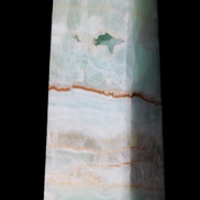 Pistachio Calcite obelisk 122mm 328g in sunlight - Rocks and Things Store