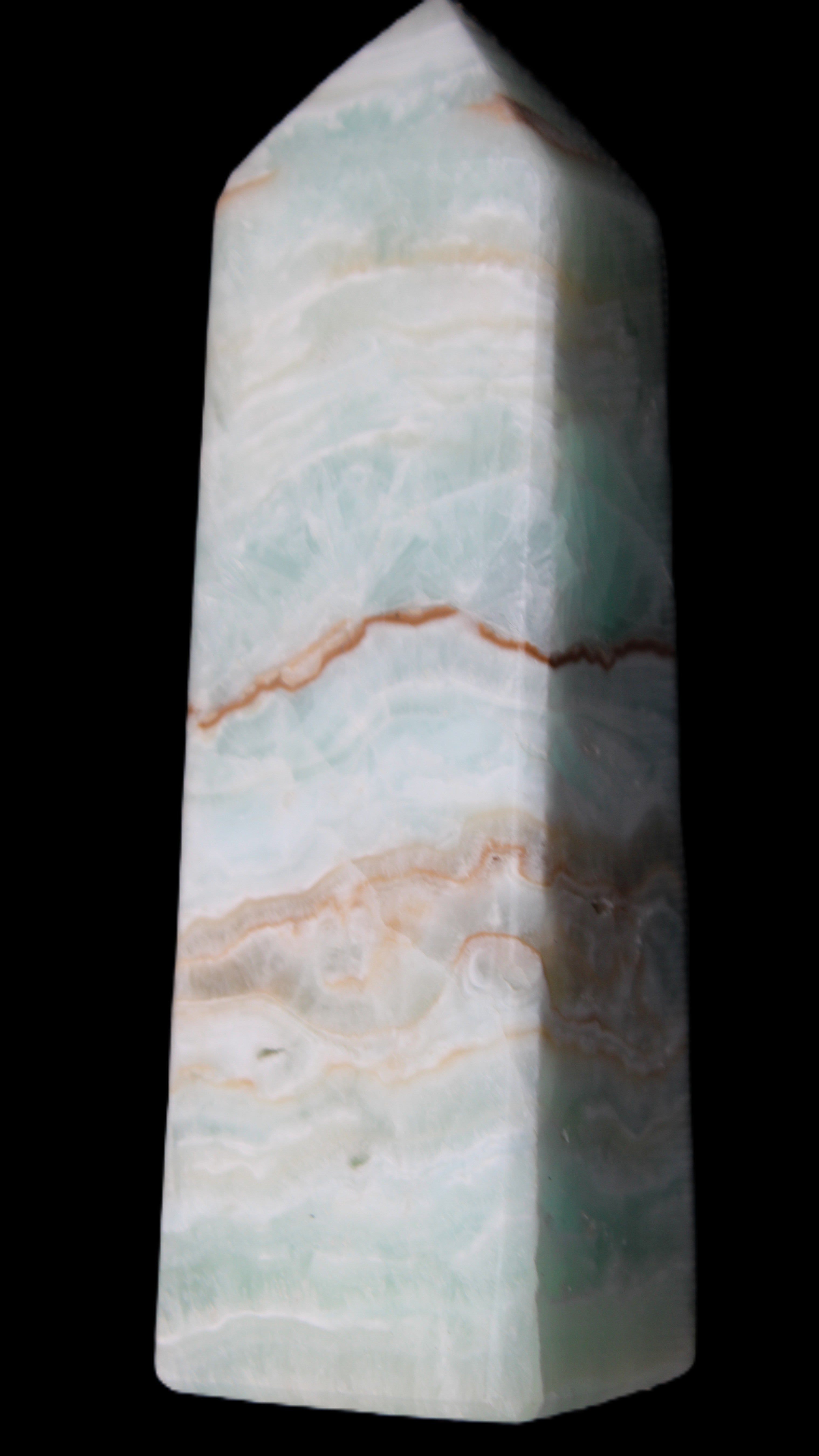 Pistachio Calcite obelisk 122mm 328g in sunlight - Rocks and Things Store