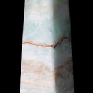 Pistachio Calcite obelisk 122mm 328g in sunlight - Rocks and Things Store