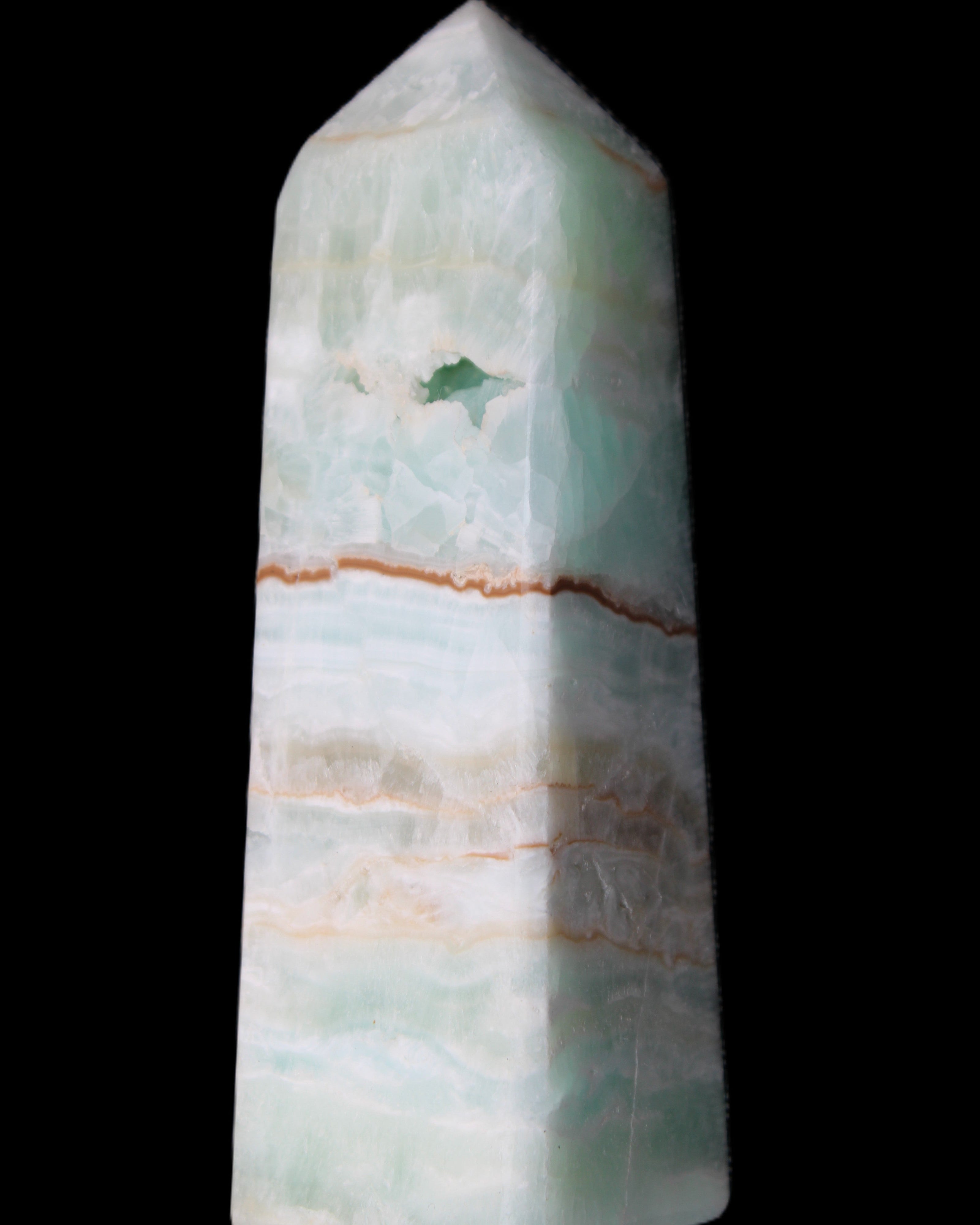 Pistachio Calcite obelisk 122mm 328g in sunlight - Rocks and Things Store