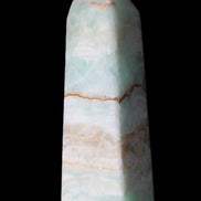 Pistachio Calcite obelisk 122mm 328g in sunlight - Rocks and Things Store