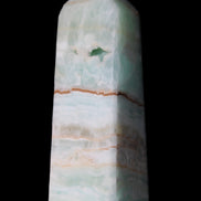 Pistachio Calcite obelisk 122mm 328g in sunlight - Rocks and Things Store
