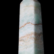 Pistachio Calcite obelisk 122mm 328g in sunlight - Rocks and Things Store