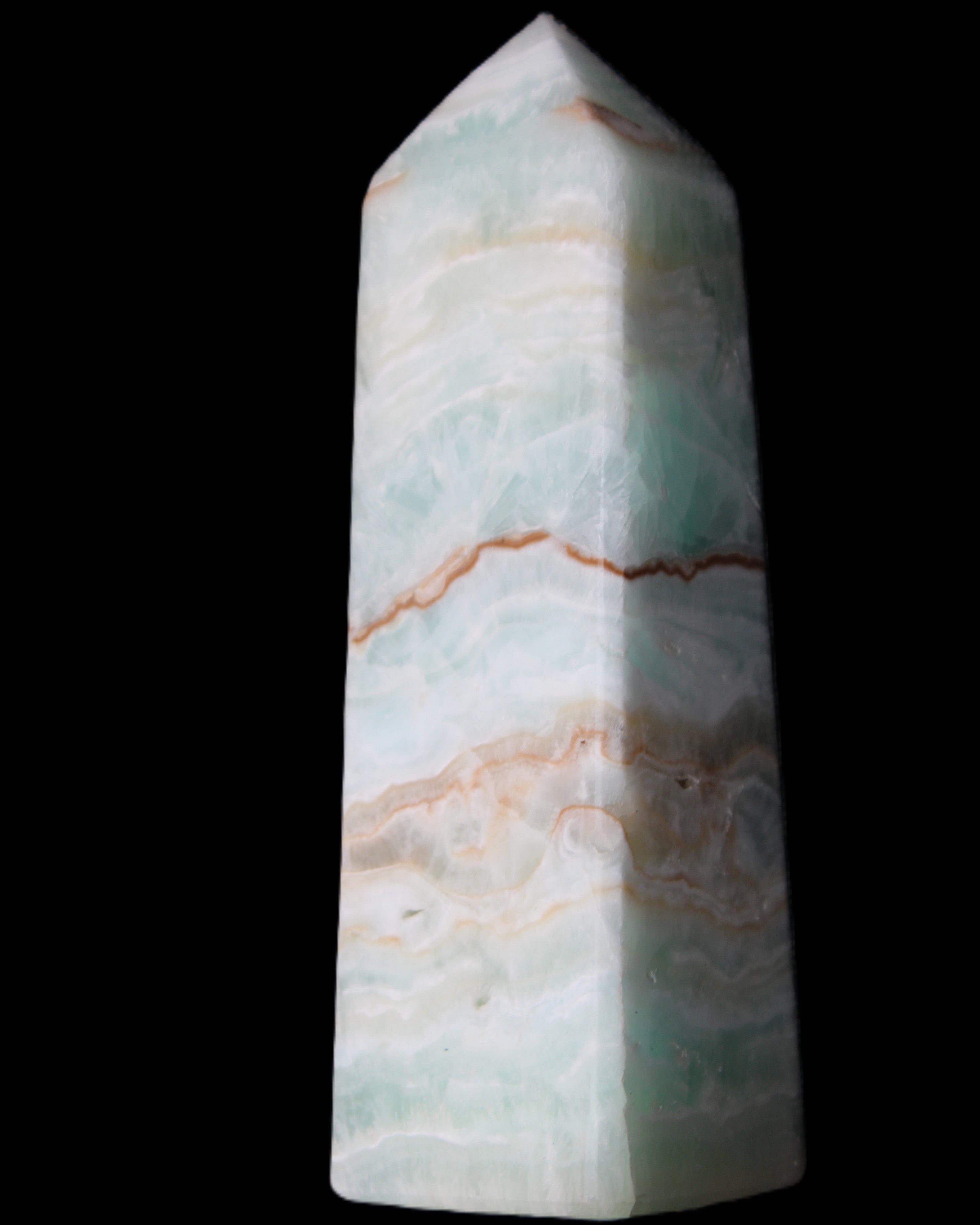 Pistachio Calcite obelisk 122mm 328g in sunlight - Rocks and Things Store