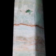 Pistachio Calcite obelisk 122mm 328g in sunlight - Rocks and Things Store