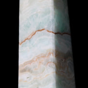 Pistachio Calcite obelisk 122mm 328g in sunlight - Rocks and Things Store