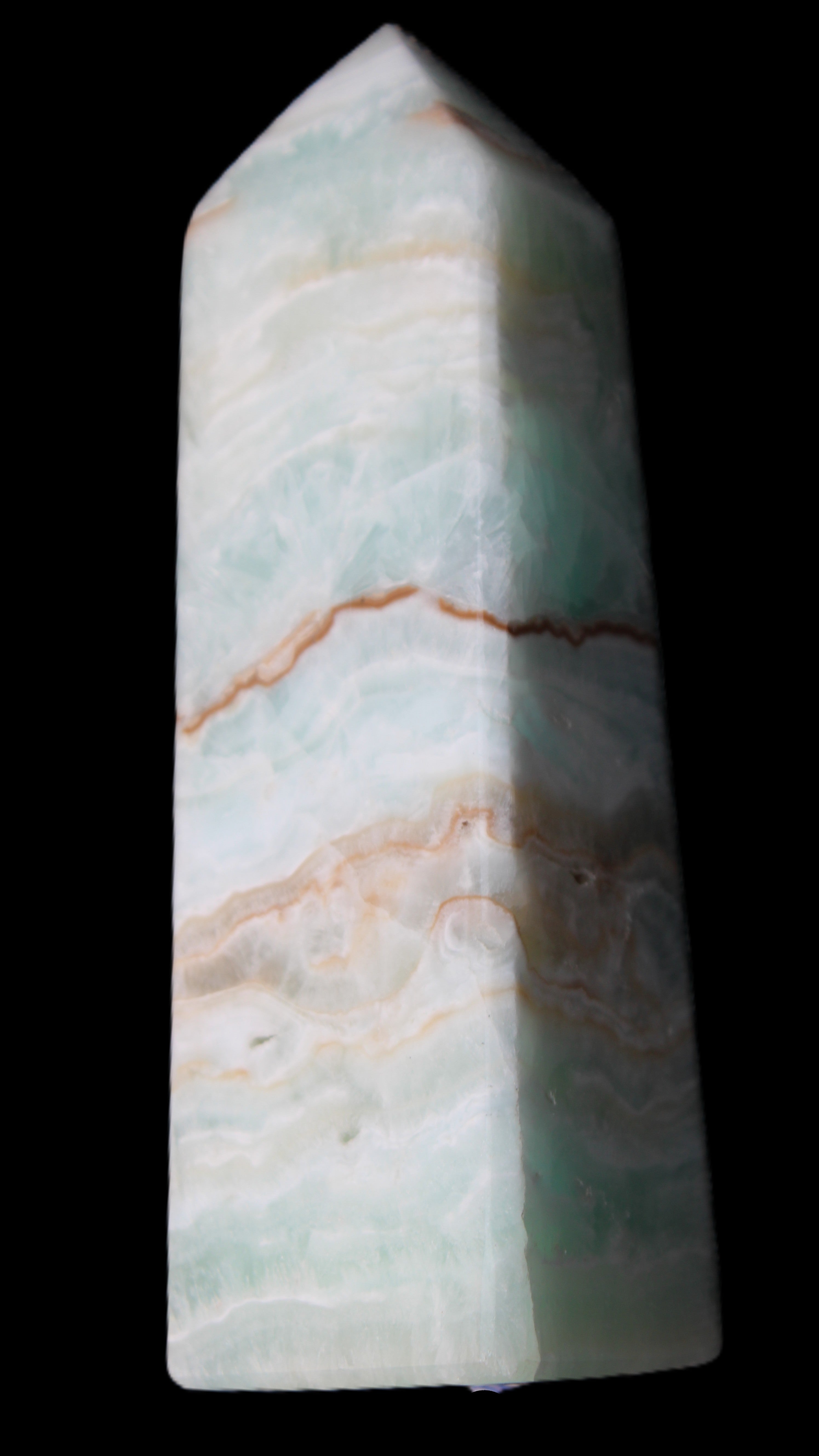 Pistachio Calcite obelisk 122mm 328g in sunlight - Rocks and Things Store