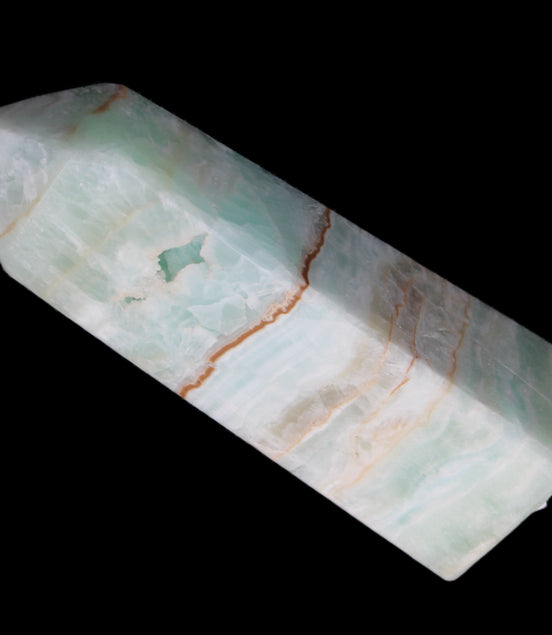 Pistachio Calcite obelisk 122mm 328g in sunlight - Rocks and Things Store