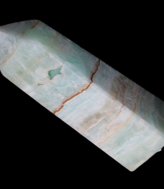 Pistachio Calcite obelisk 122mm 328g in sunlight - Rocks and Things Store