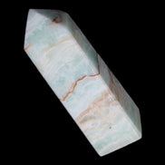 Pistachio Calcite obelisk 122mm 328g in sunlight - Rocks and Things Store