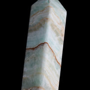 Pistachio Calcite obelisk 120mm 300g in sunlight - Rocks and Things Store