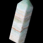 Pistachio Calcite obelisk 120mm 300g in sunlight - Rocks and Things Store