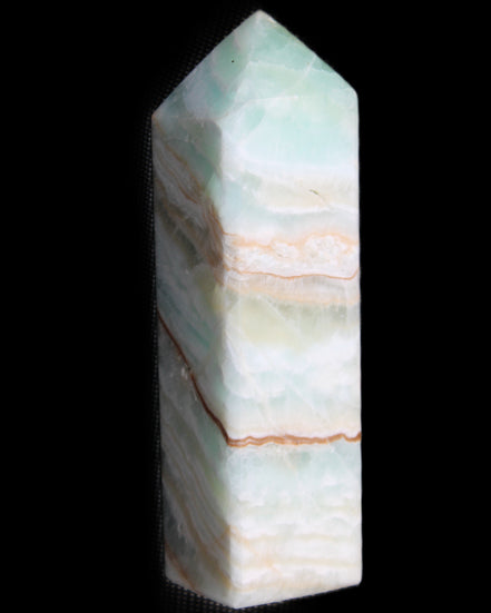 Pistachio Calcite obelisk 120mm 300g in sunlight - Rocks and Things Store