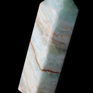 Pistachio Calcite obelisk 120mm 300g in sunlight - Rocks and Things Store