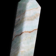 Pistachio Calcite obelisk 120mm 300g in sunlight - Rocks and Things Store