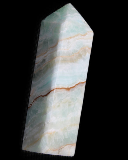 Pistachio Calcite obelisk 120mm 300g in sunlight - Rocks and Things Store