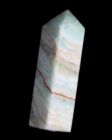 Pistachio Calcite obelisk 120mm 300g in sunlight - Rocks and Things Store
