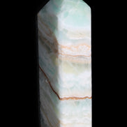 Pistachio Calcite obelisk 120mm 300g in sunlight - Rocks and Things Store