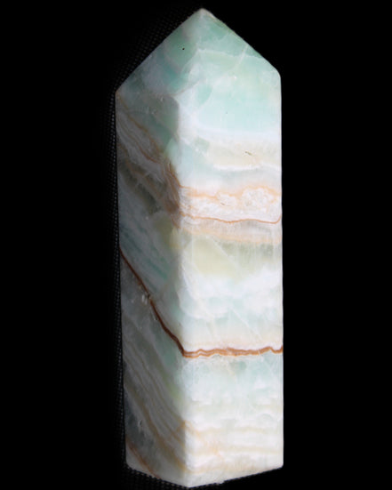 Pistachio Calcite obelisk 120mm 300g in sunlight - Rocks and Things Store