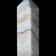 Pistachio Calcite obelisk 120mm 300g in sunlight - Rocks and Things Store