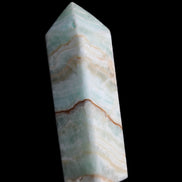 Pistachio Calcite obelisk 120mm 300g in sunlight - Rocks and Things Store