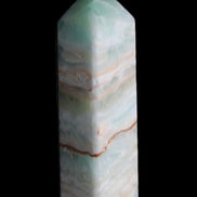 Pistachio Calcite obelisk 120mm 300g in sunlight - Rocks and Things Store