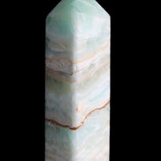 Pistachio Calcite obelisk 120mm 300g in sunlight - Rocks and Things Store