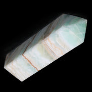Pistachio Calcite obelisk 120mm 300g in sunlight - Rocks and Things Store