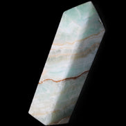 Pistachio Calcite obelisk 120mm 300g in sunlight - Rocks and Things Store