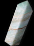 Pistachio Calcite obelisk 120mm 300g in sunlight - Rocks and Things Store